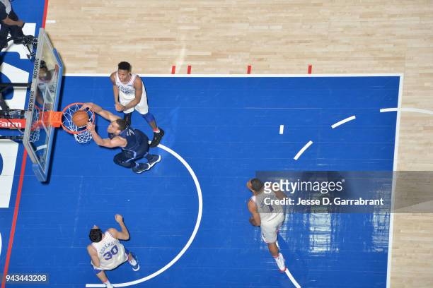 Dwight Powell of the Dallas Mavericks dunks the ball against the Philadelphia 76ers on April 8, 2018 at Wells Fargo Center in Philadelphia,...