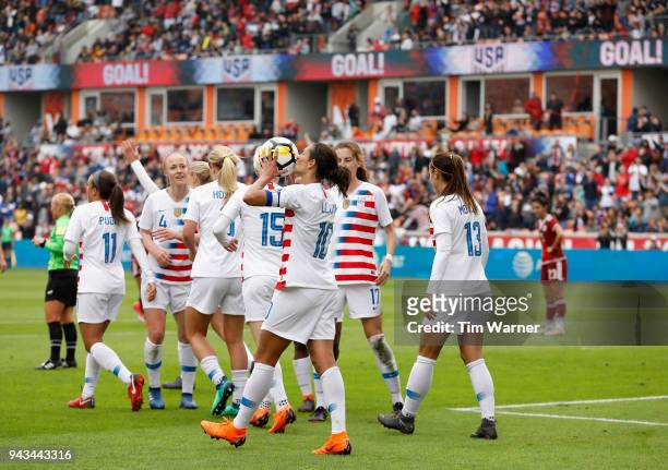 Carli Lloyd of United States kisses the ball after scoring a goal in the first half against the Mexico at BBVA Compass Stadium on April 8, 2018 in...