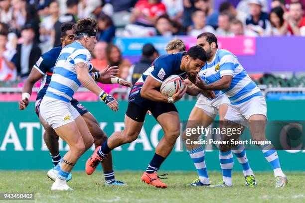 Martin Iosefo of USA fights for the ball during the HSBC Hong Kong Sevens 2018 match for Plate Final between Argentina and USA on April 7, 2018 in...