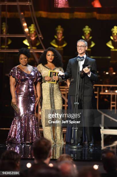 Hugh Durrant winner of the award for Best Costume Design for 'Dick Whittington' is seen on stage with Moya Angela , Marisha Wallace and Karen Mav...