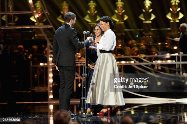 Meera Syal and Nina Sosanya present Bertie Carvel with the award for Best Actor In A Supporting Role for 'Ink' on stage during The Olivier Awards...