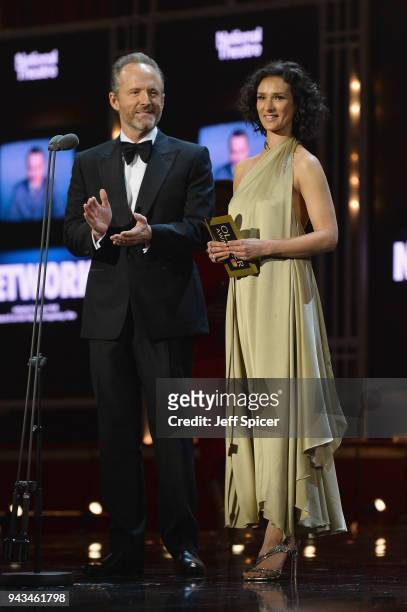 John Benjamin Hickey and Indira Varma present the award for Best Actor on stage during The Olivier Awards with Mastercard at Royal Albert Hall on...