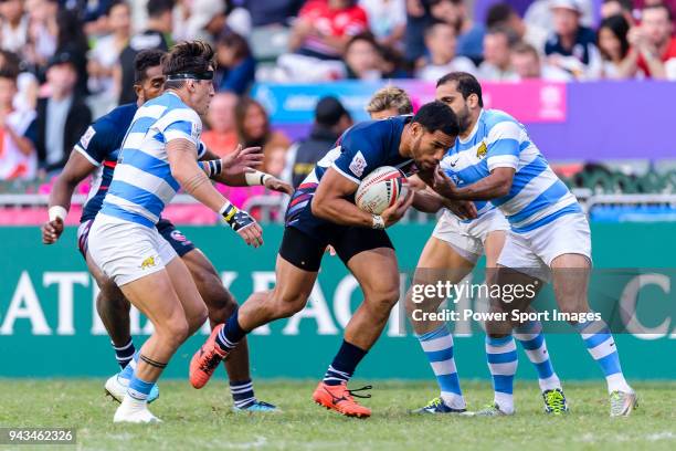 Martin Iosefo of USA fights for the ball during the HSBC Hong Kong Sevens 2018 match for Plate Final between Argentina and USA on April 8, 2018 in...