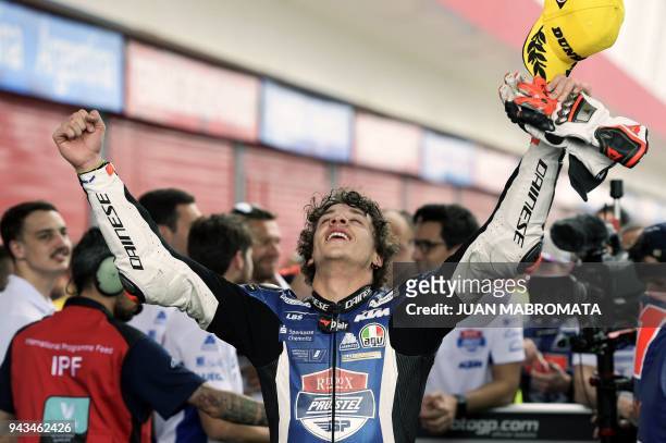 Italy's KTM biker Marco Bezzecchi celebrates at parc ferme after wining the Moto3 race of the Argentina Grand Prix at Termas de Rio Hondo circuit, in...