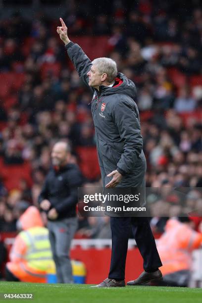 Arsenal Manager Arsene Wenger instructs his team during the Premier League match between Arsenal and Southampton at Emirates Stadium on April 8, 2018...