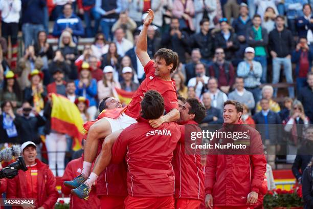 David Ferrer of Spain celebrates the victory with his teammates in is match against Philipp Kohlschreiber of Germany during day three of the Davis...
