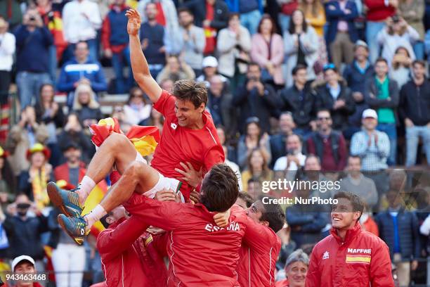 David Ferrer of Spain celebrates the victory with his teammates in is match against Philipp Kohlschreiber of Germany during day three of the Davis...