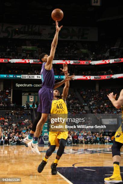 Jeremy Lamb of the Charlotte Hornets shoots the ball against Glenn Robinson III of the Indiana Pacers on April 8, 2018 at Spectrum Center in...