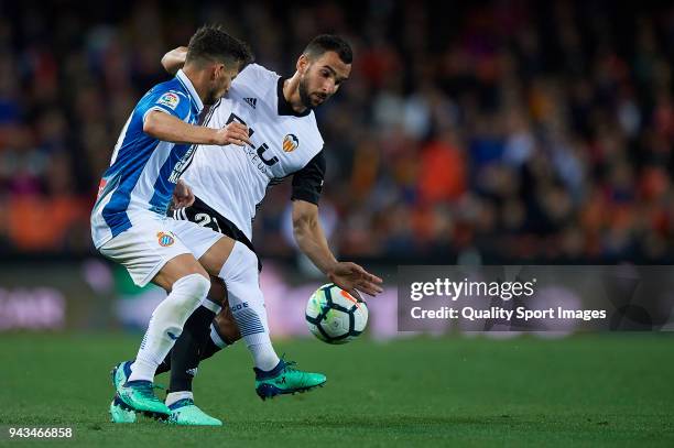 Martin Montoya of Valencia competes for the ball with Pablo Piatti of Espanyol during the La Liga match between Valencia and Espanyol at Mestalla...