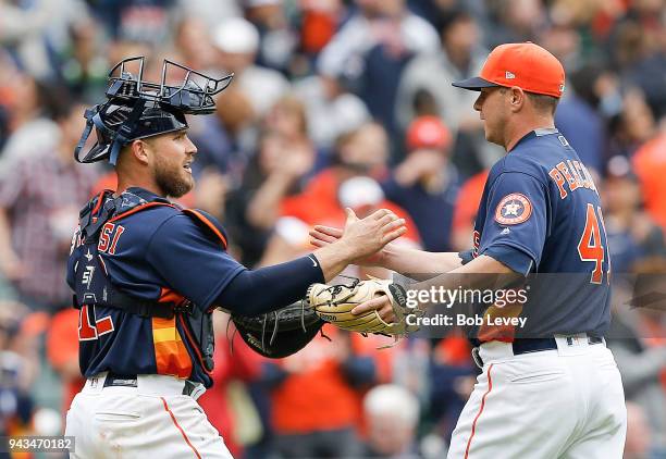 Brad Peacock of the Houston Astros shakes hands with Max Stassi after the final out against the San Diego Padres at Minute Maid Park on April 8, 2018...