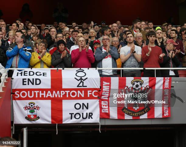 Southampton supporters applaud the recently deceased Ray Wilkins before the Premier League match between Arsenal and Southampton at Emirates Stadium...