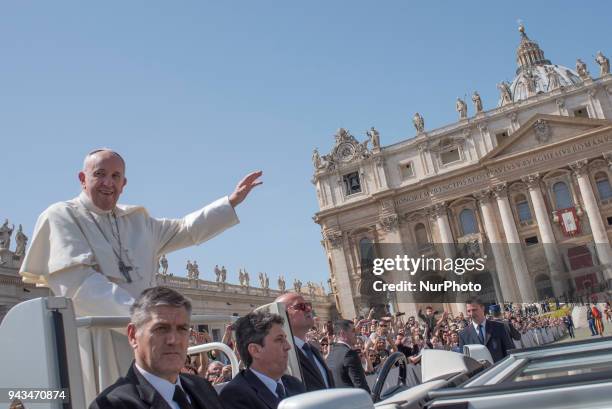 Pope Francis leaves St. Peter's Square at the Vatican after a Mass on the Sunday of Divine Mercy, Sunday, April 8, 2018.