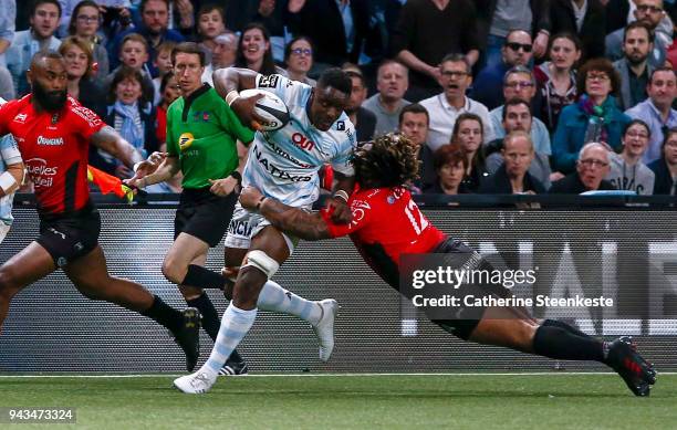 Yannick Nyanga of Racing 92 is tackled by Mathieu Bastareaud of RC Toulon during the French Top 14 match between Racing 92 and RC Toulon at U Arena...