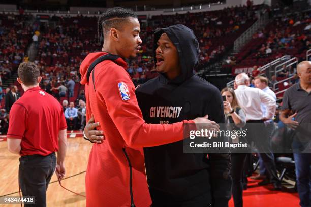 Gerald Green of the Houston Rockets hugs Deshaun Watson of the Houston Texans before the game against the Portland Trail Blazers on April 5, 2018 at...