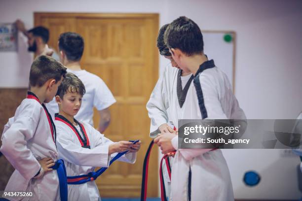 on taekwondo training - karate belt stock pictures, royalty-free photos & images