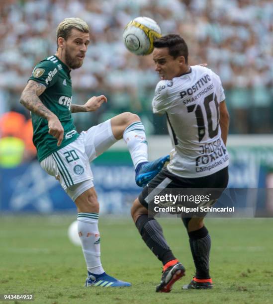 Lucas Lima of Palmeiras vies for the ball with Jadson of Corinthians during a match between Palmeiras and Corinthians in the final of Paulista...