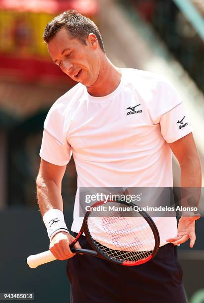 Philipp Kohlschreiber of Germany reacts during his match against David Ferrer of Spain during day three of the Davis Cup World Group Quarter Final...