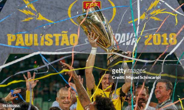 Goalkeeper Cassio of Corinthians holds the trophy after the team defeats Palmeiras and wins the final of Paulista Championship 2018 at Allianz Parque...