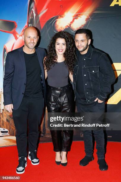 Franck Gastambide, Sabrina Ouazani and Malik Bentalha attend "Taxi 5" Paris Premierere at Le Grand Rex on April 8, 2018 in Paris, France.