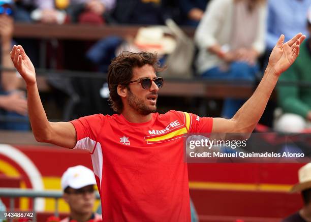 Feliciano Lopez of Spain reacts for David Ferrer of Spain during his match against Philipp Kohlschreiber of Germany during day three of the Davis Cup...