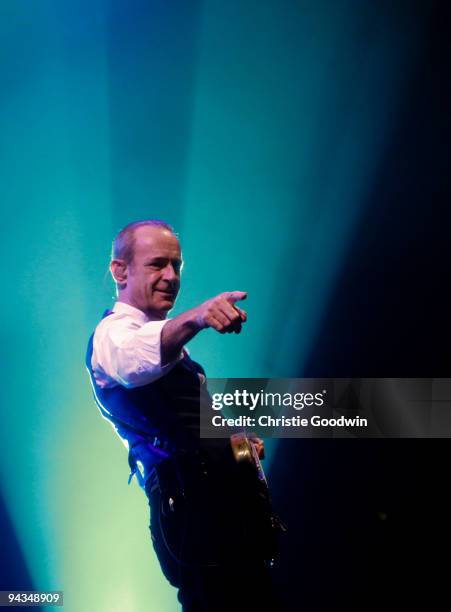 Francis Rossi of Status Quo performs on stage at Wembley Arena on December 12, 2009 in London, England.