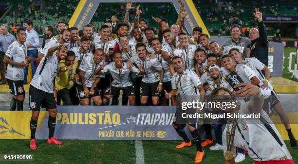 Angel Romero of Corinthians takes a selfie after the team defeats Palmeiras and wins the final of Paulista Championship 2018 at Allianz Parque on...