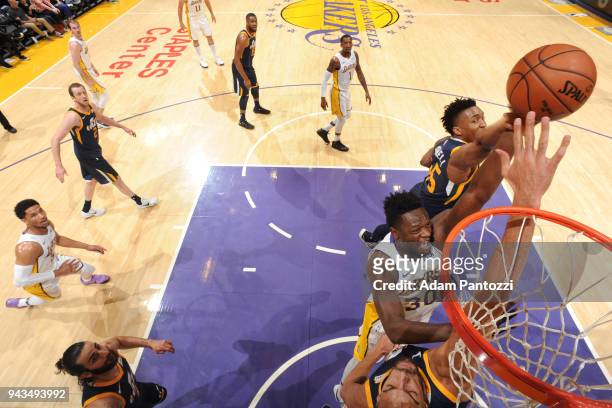 Julius Randle of the Los Angeles Lakers goes to the basket between Rudy Gobert of the Utah Jazz and Donovan Mitchell of the Utah Jazz on April 8,...