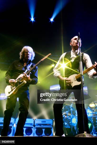 Rick Parfitt and Francis Rossi of Status Quo perform on stage at Wembley Arena on December 12, 2009 in London, England.