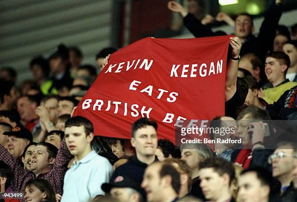 Manchester United fans hold up a banner questioning the mental stability of rival Newcastle United manager Kevin Keegan during an FA Carling...