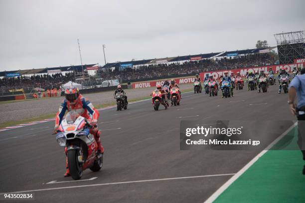 Marc Marquez of Spain and Repsol Honda Team push the bike on the grid while the MotoGP riders are ready to start on the grid during the MotoGP race...