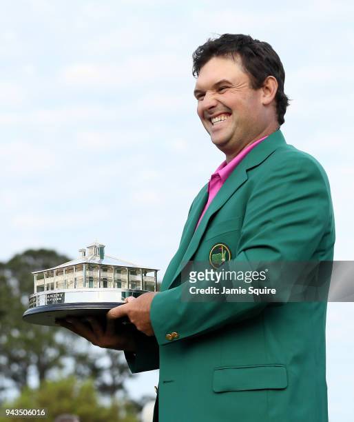 Patrick Reed of the United States celebrates with the trophy during the green jacket ceremony after winning the 2018 Masters Tournament at Augusta...