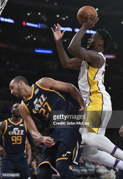 Julius Randle of the Los Angeles Lakers runs into the back of Rudy Gobert of the Utah Jazz , who was called for a foul in the first half at Staples...