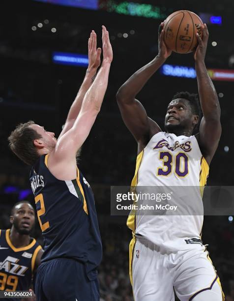 Joe Ingles of the Utah Jazz gurards Julius Randle of the Los Angeles Lakers in the first half at Staples Center on April 8, 2018 in Los Angeles,...