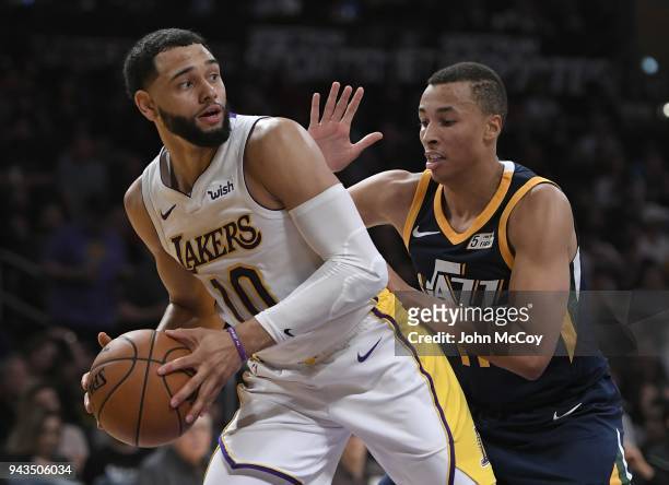 Tyler Ennis of the Los Angeles Lakers looks to pass the ball while being guarded by Dante Exum of the Utah Jazz in the first half at Staples Center...