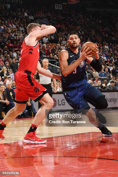 Nikola Vucevic of the Orlando Magic drives to the basket during the game against the Toronto Raptors on April 8, 2018 at the Air Canada Centre in...