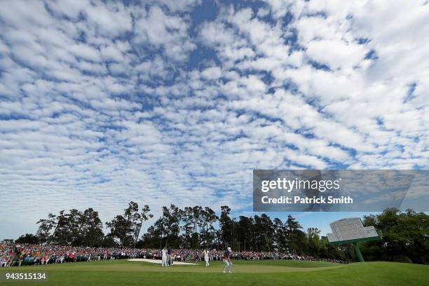 General view is seen as Cameron Smith of Australia putts on the 18th green during the final round of the 2018 Masters Tournament at Augusta National...