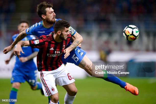 Francesco Acerbi of US Sassuolo competes for the ball with Patrick Cutrone of AC Milan during the Serie A football match between AC Milan ad US...