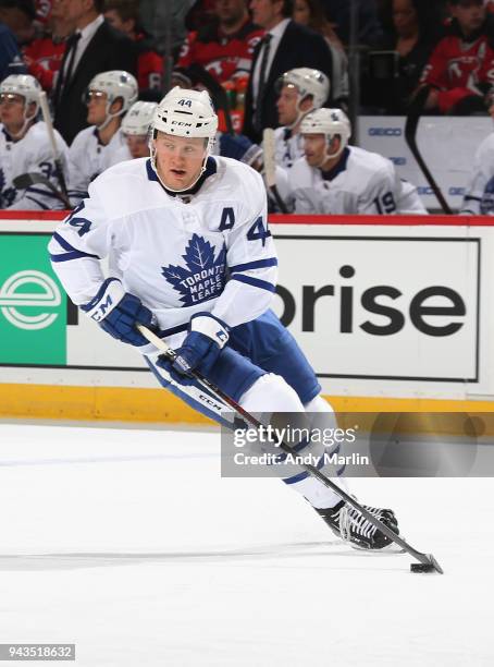 Morgan Rielly of the Toronto Maple Leafs plays the puck during the game against the New Jersey Devils at Prudential Center on April 5, 2018 in...