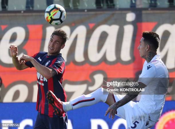 Crotone's Deutch midfielder Oliver Kragl fights for the ball with Bologna's Chilean midfielder Erick Pulgar during the Italian Serie A football match...