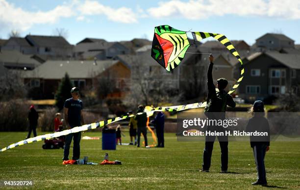 Brian Milhaupt tries to get his 15 meter long kite into the air during the annual Arvada Kite Festival at Stegner Sports Complex on April 8, 2018 in...