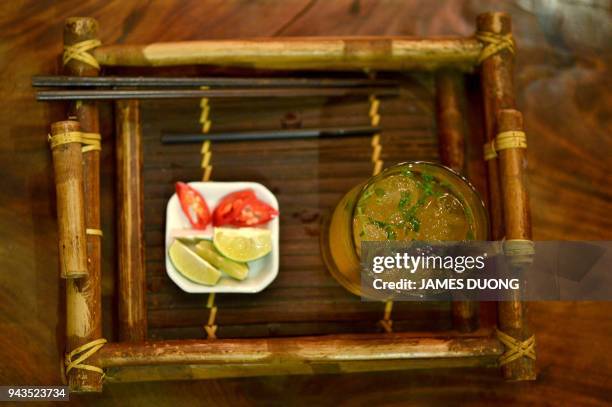 This picture taken on March 21, 2018 shows a signature "pho cocktail" at the cocktail bar Ne in Hanoi. The Hanoi's hipster bar is making a splash...