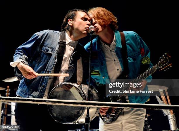 William Butler and Richard Reed Parry of Arcade Fire perform live on stage at Manchester Arena on April 8, 2018 in Manchester, England.