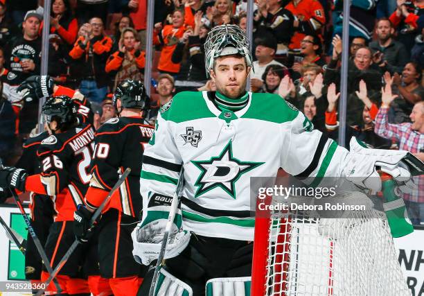 Goalie Mike McKenna of the Dallas Stars reacts after giving up a first-period goal to Rickard Rakell of the Anaheim Ducks during the first period of...