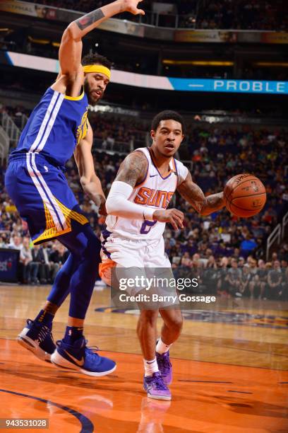 Tyler Ulis of the Phoenix Suns passes the ball during the game against JaVale McGee of the Golden State Warriors on April 8, 2018 at Talking Stick...