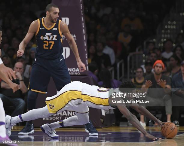 Rudy Gobert of the Utah Jazz watches Julius Randle of the Los Angeles Lakers dive for a loose ball in the second half at Staples Center on April 8,...
