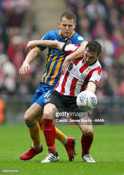 Lee Frecklington of Lincoln City and Bryn Morris of Shrewsbury Town during the Checkatrade Trophy Final between Lincoln City and Shrewsbury Town at...