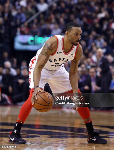 Norman Powell of the Toronto Raptors dribbles the ball during the first half of an NBA game against the Boston Celtics at Air Canada Centre on April...