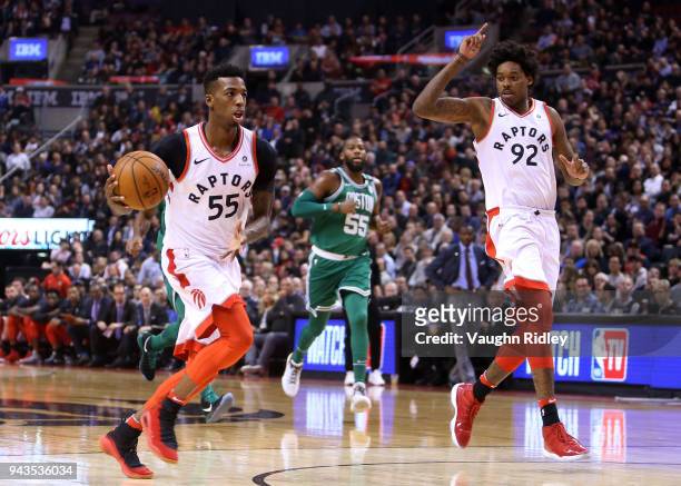 Delon Wright of the Toronto Raptors passes the ball to Lucas Nogueira during the first half of an NBA game against the Boston Celtics at Air Canada...