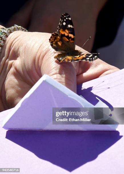 Mayor Carolyn Goodman releases a painted lady butterfly during the Nathan Adelson Hospice Route 91 Remembrance ceremony at the Las Vegas Community...