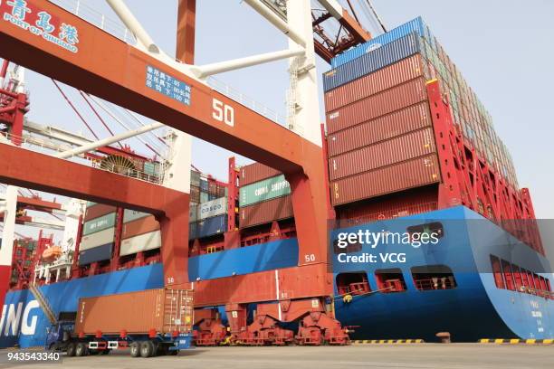 Autumn cargo ship carrying containers stop at Qingdao Port on April 8, 2018 in Qingdao, Shandong Province of China. China has been prepared to strike...